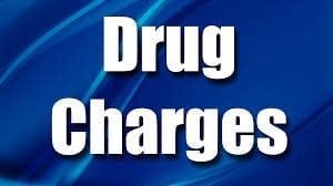 Drug Charges text on a blue background for legal services.